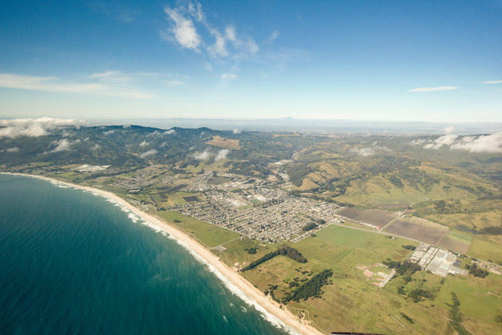 Aerial view of Half Moon Bay and surrounding landscape